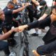Photo of a police officer fist bumping a protester in Atlanta