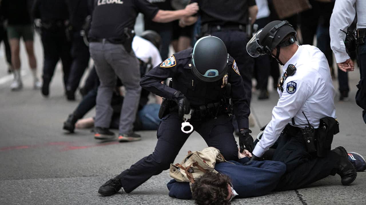 Photo of police arresting a protester in New York
