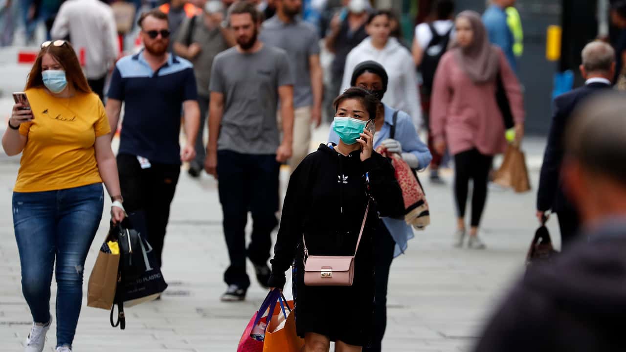 Photo of people wearing masks in London