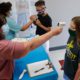 Image of masked students being given temperature checks in Wylie, Texas