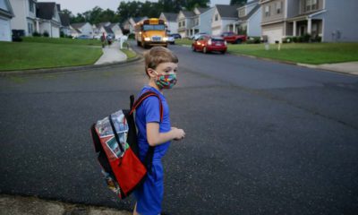 Photo of Paul Adams waiting for the bus
