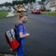 Photo of Paul Adams waiting for the bus