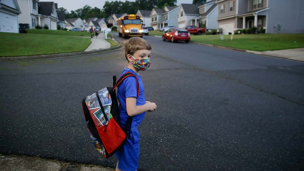 Photo of Paul Adams waiting for the bus